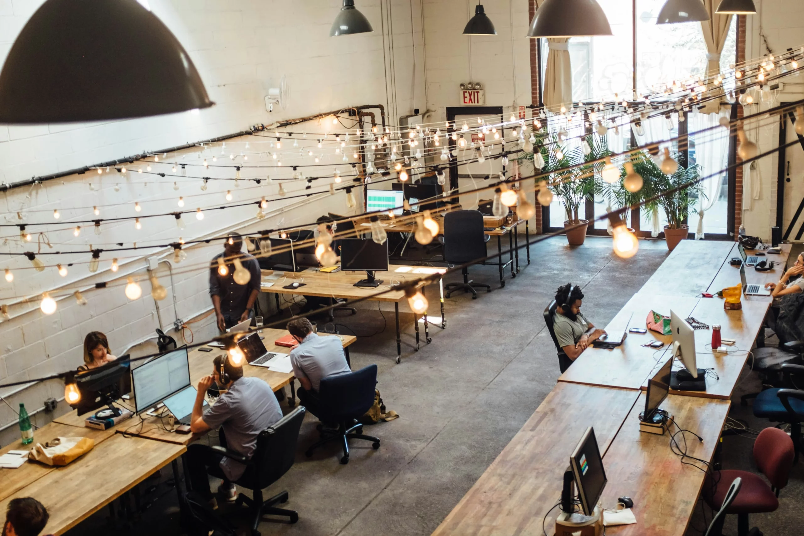 open concept office space with employees working on various projects