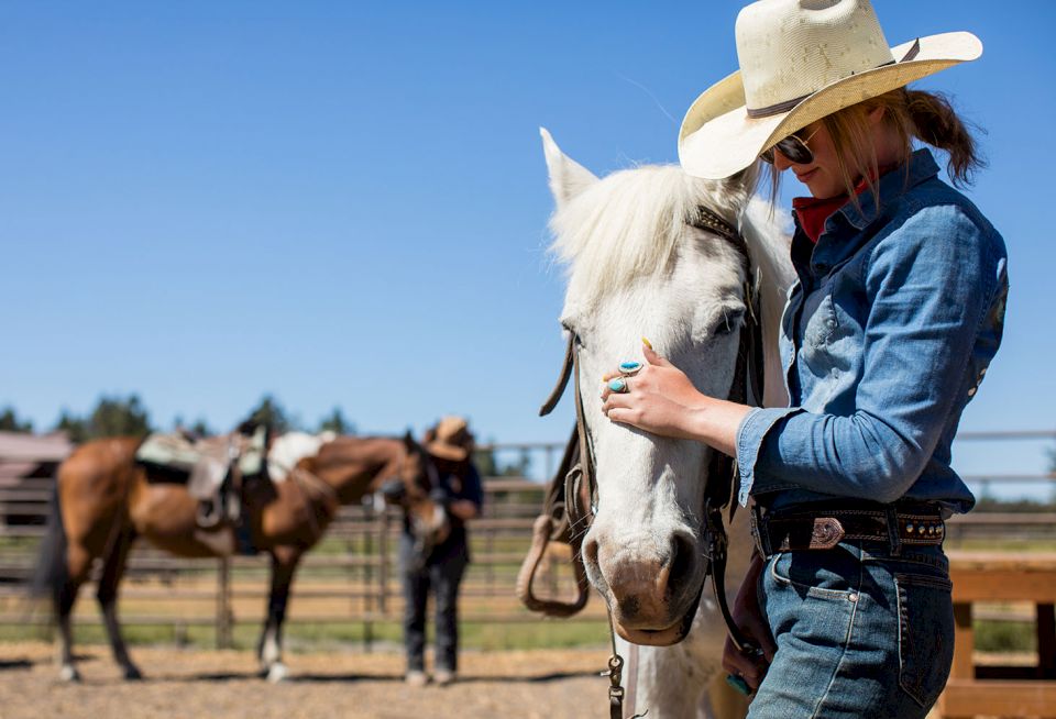 cowgirl with a white horse at sunriver resort