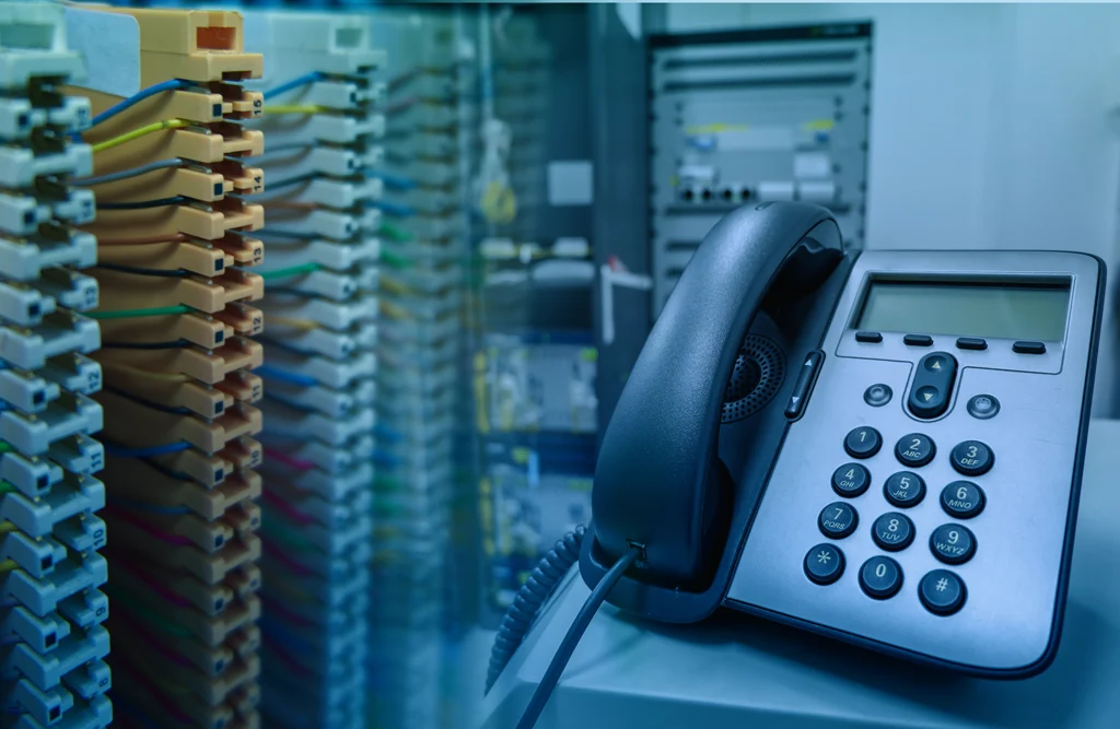 older business phone with server behind it for aging on-premises systems